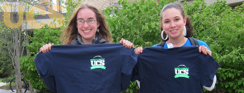 Two majors lifting up program shirts for Transfer Information Page